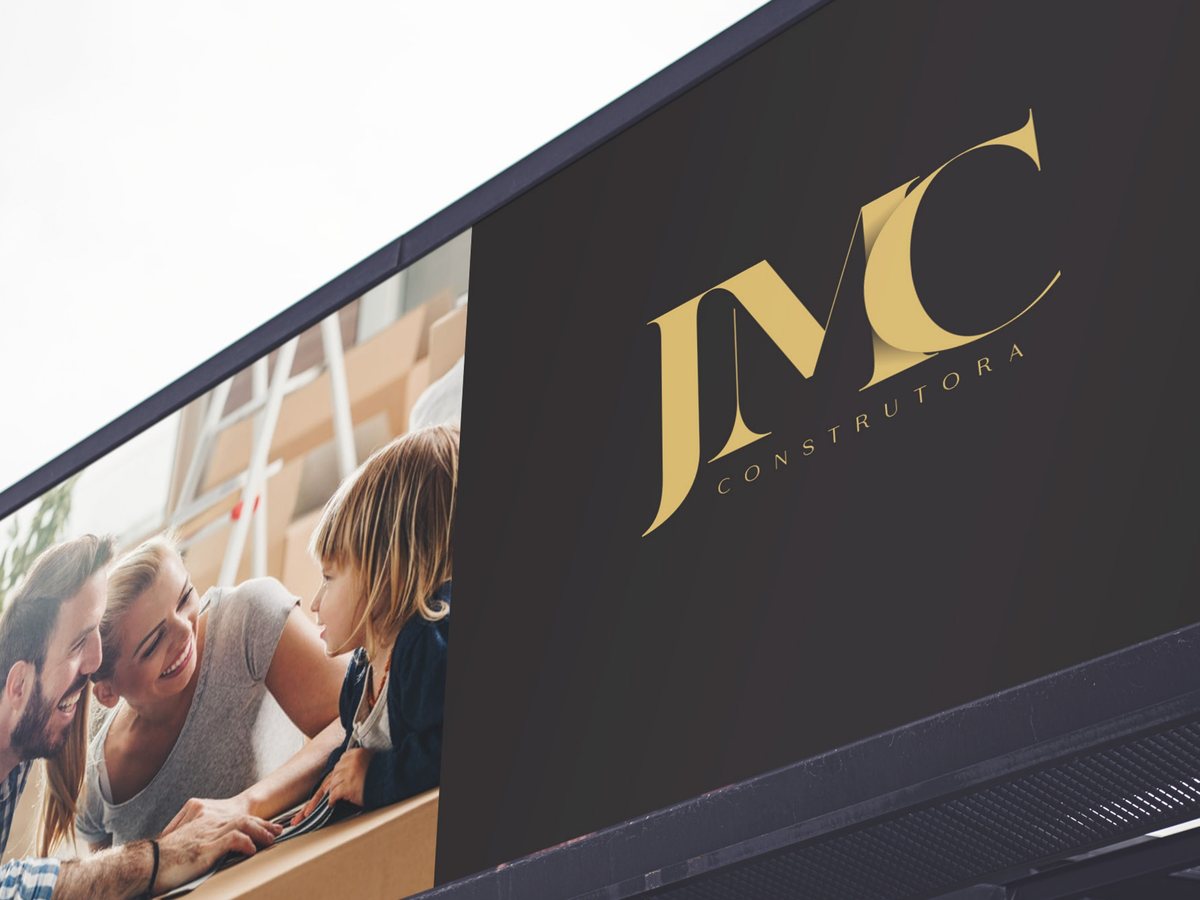 Painel JMC Construtora com o monograma dourado